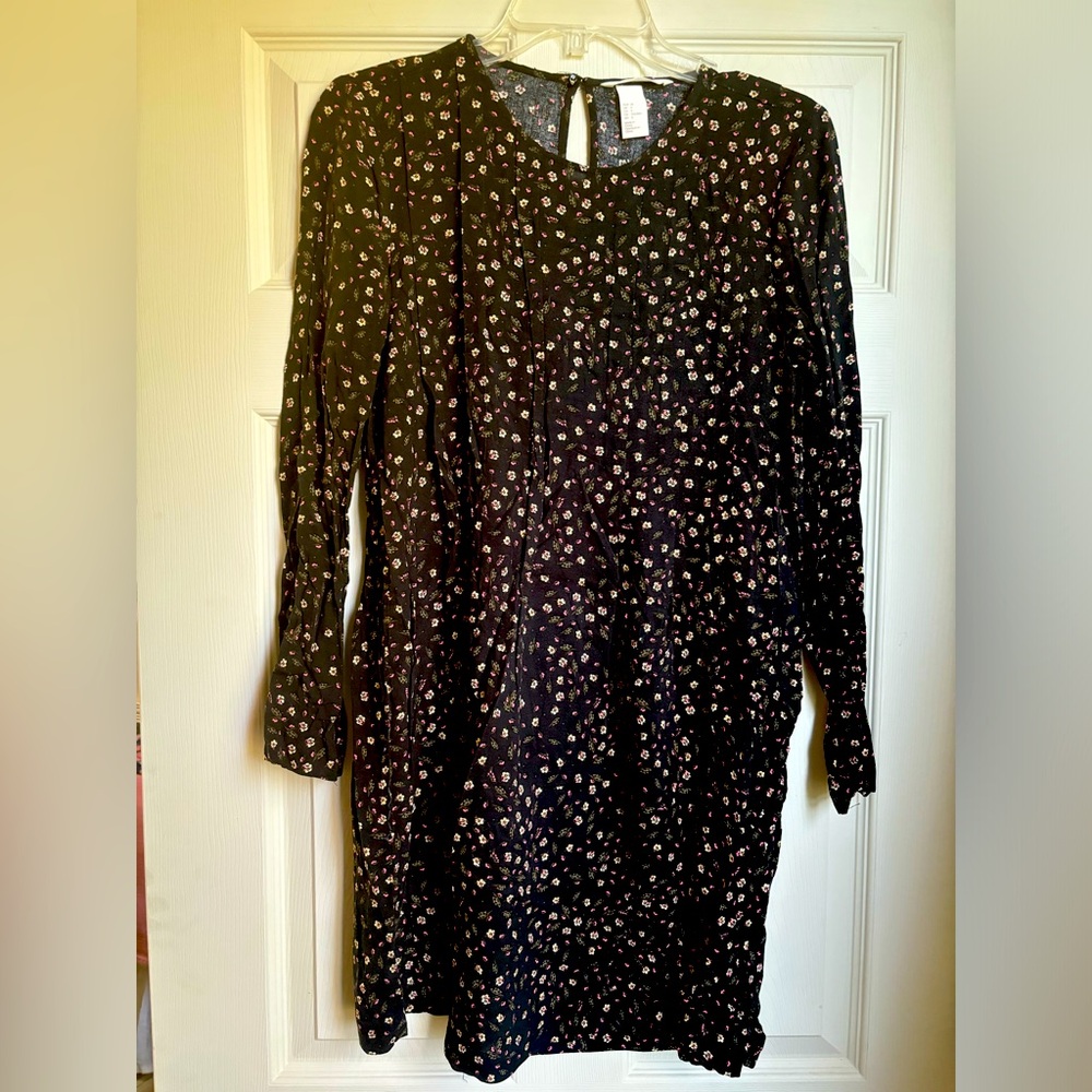 Black pleated dress with floral detail